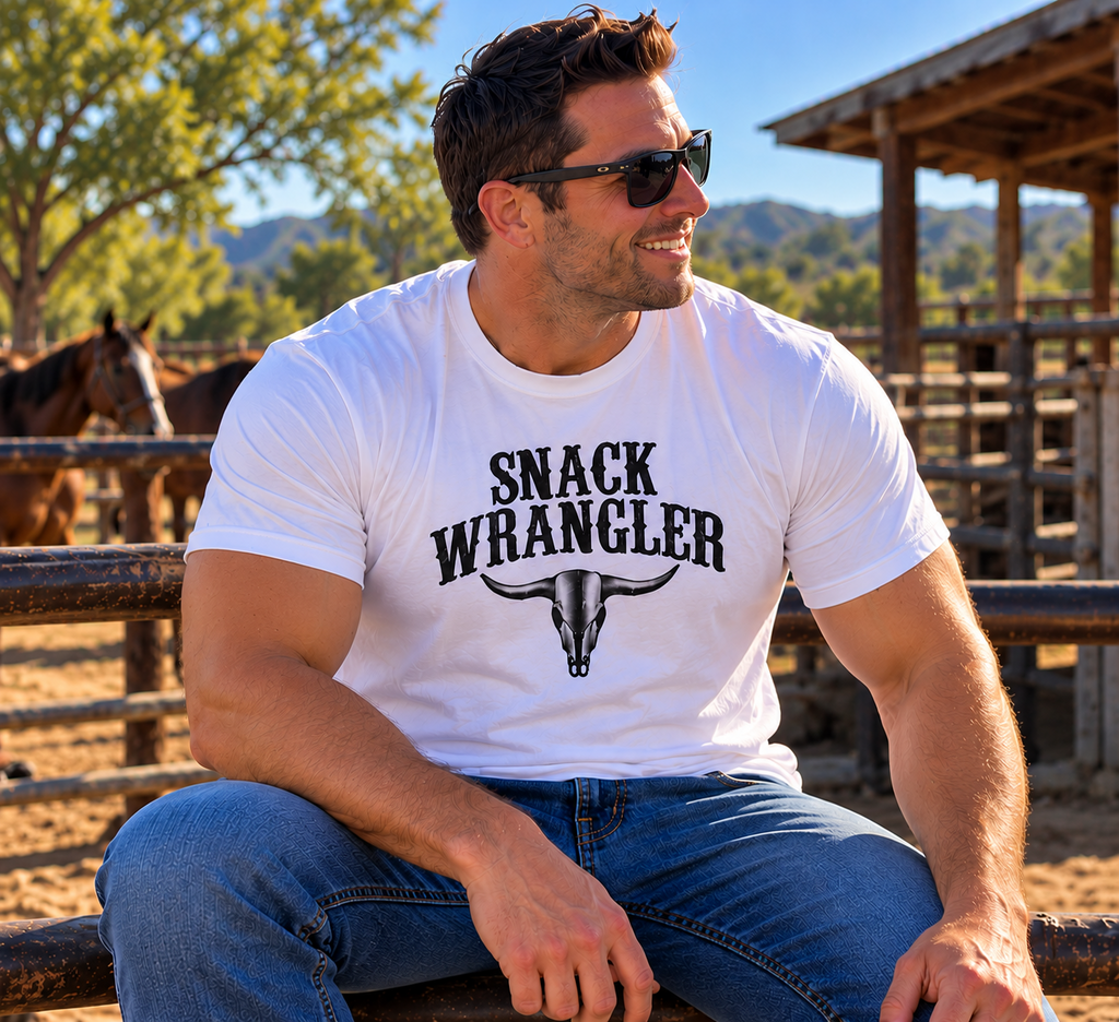 Man in white Snack Wrangler tee at ranch